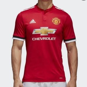 Manchester United jersey with button collar.